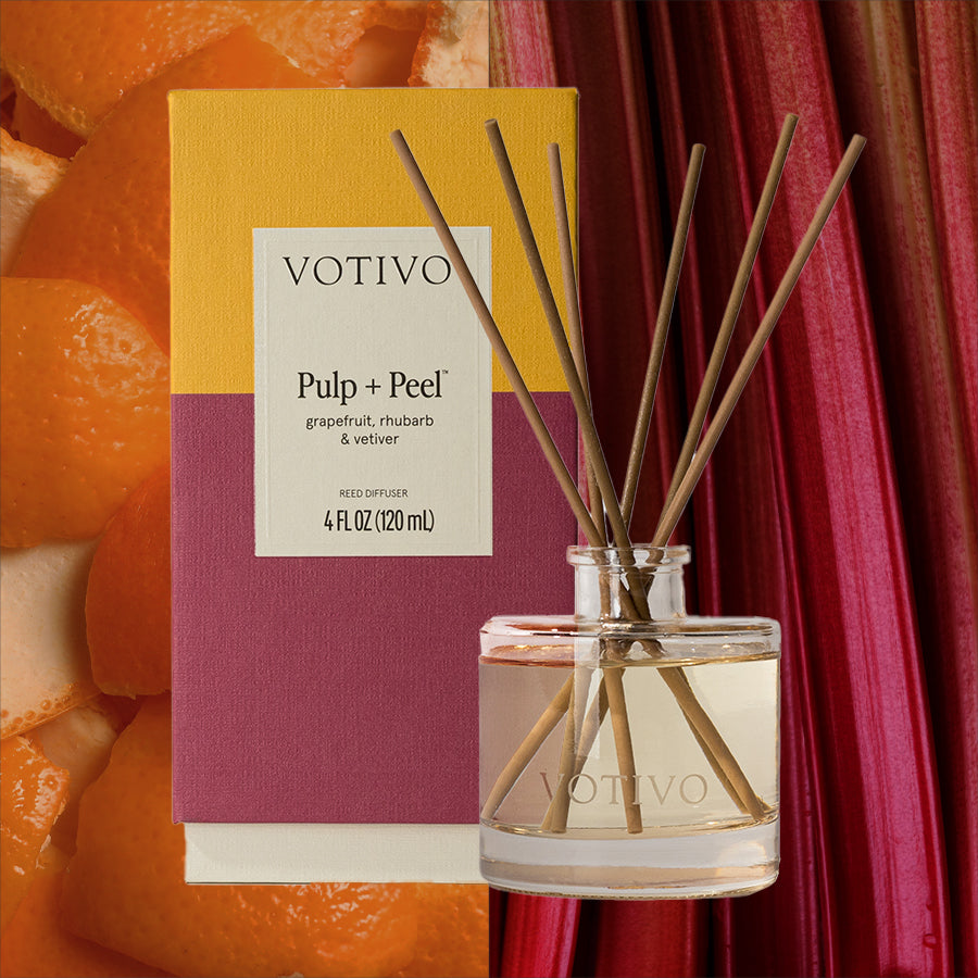 The Votivo Pulp + Peel Reed Diffuser features fiber reeds in a yellow and purple box, filling your space with notes of grapefruit, rhubarb, and vetiver for a continuous scent inspired by grapefruit peels and rhubarb stalks.