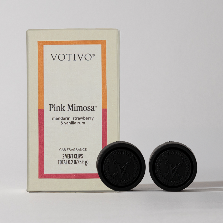 A Votivo Pink Mimosa Car Fragrance (2 Pack) with two black vent clips, each 0.2 oz (5.6 g). This fruity car air freshener blends mandarin, strawberry, and vanilla rum notes for a fresh driving experience.