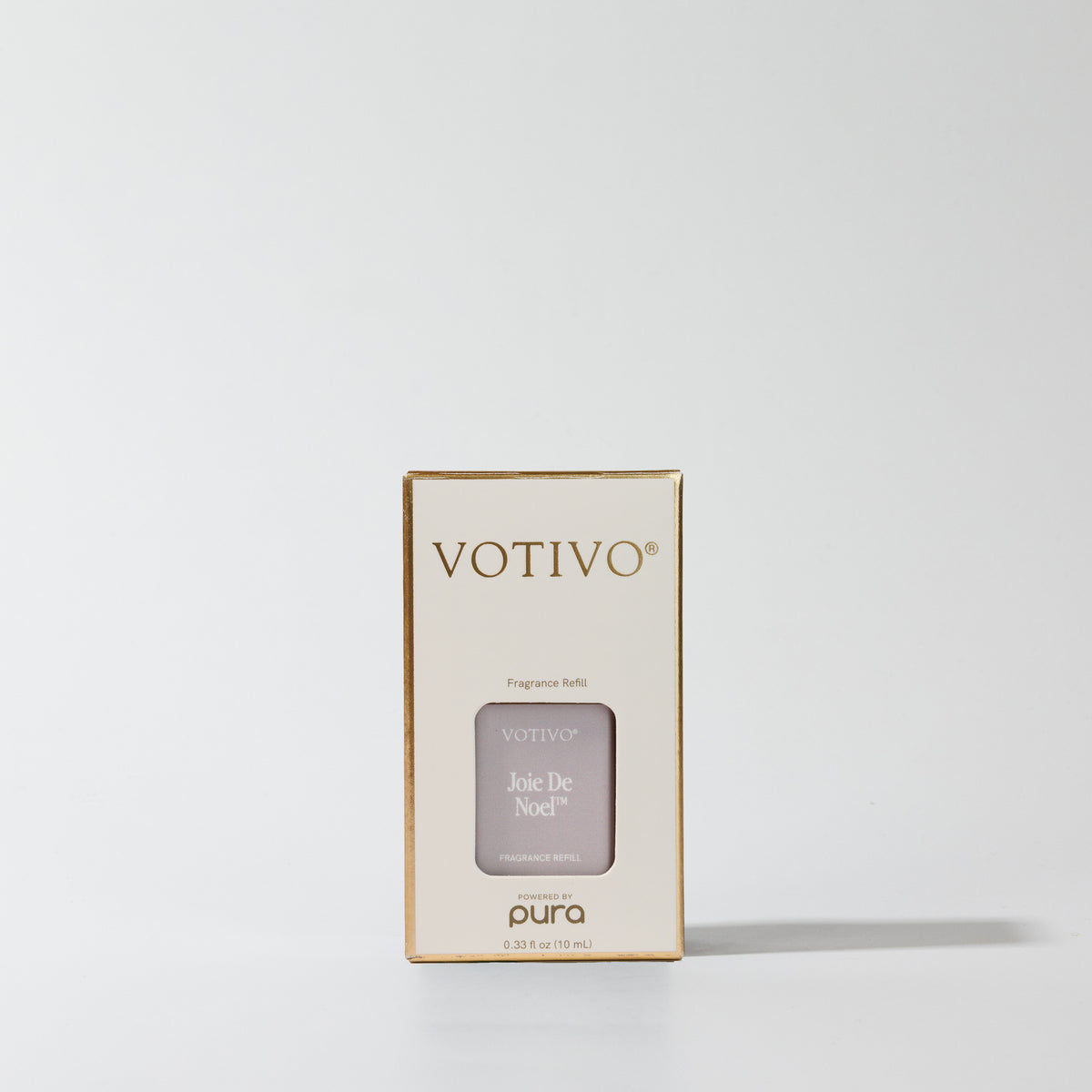 A rectangular Joie De Noel Pura + Votivo Smart Fragrance Refill box with gold lettering.