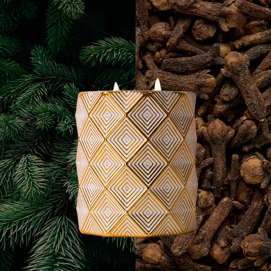 The Votivo Sequoia Fir Holiday Decorative Candle features soy blend wax in a gold-patterned vessel, surrounded by fir branches and whole cloves to enhance its natural, festive aromas.